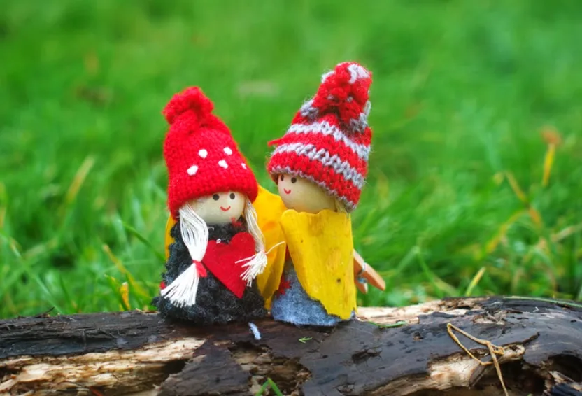 two doll wearing knit caps photo